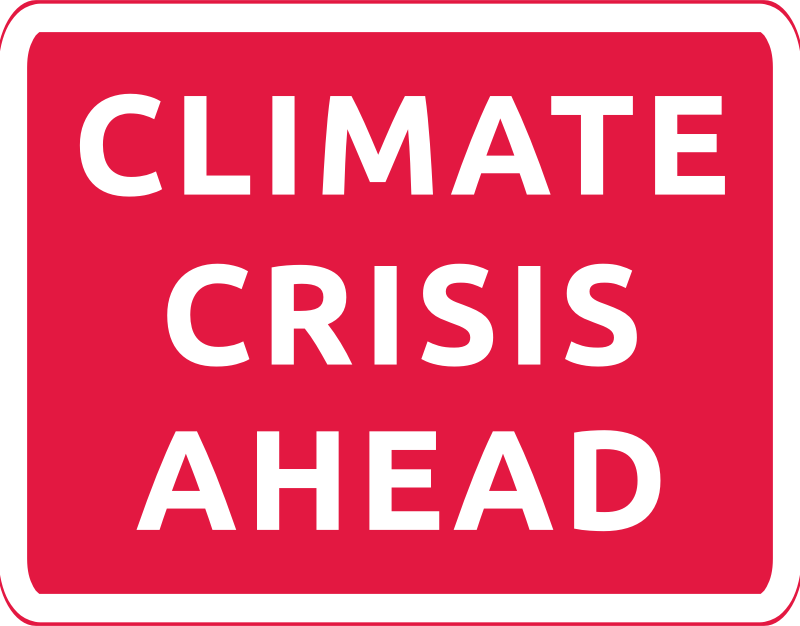 Climate crisis ahead red road sign 