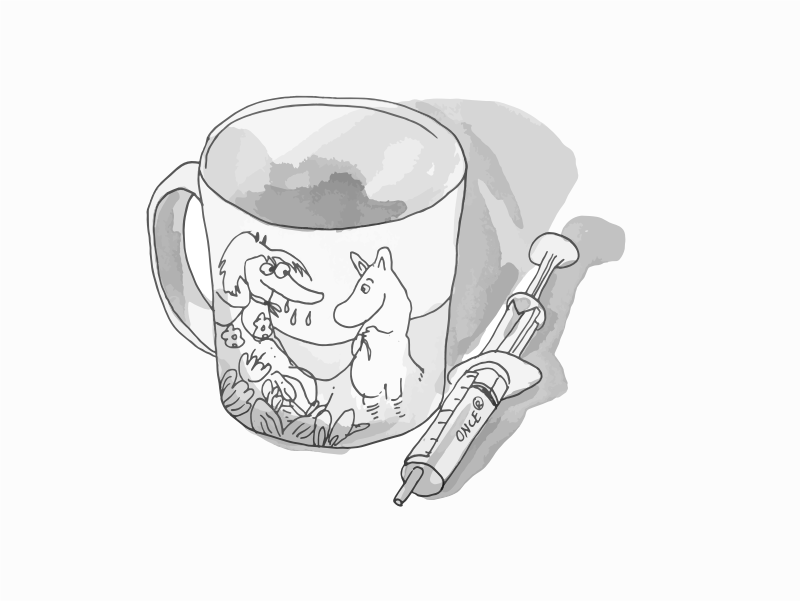 Moomin character cup and a syringe