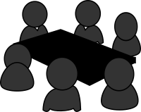 Meeting around a table in grayscale