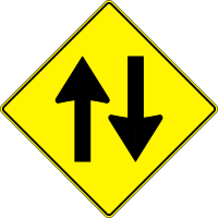 yellow road sign - two way traffic