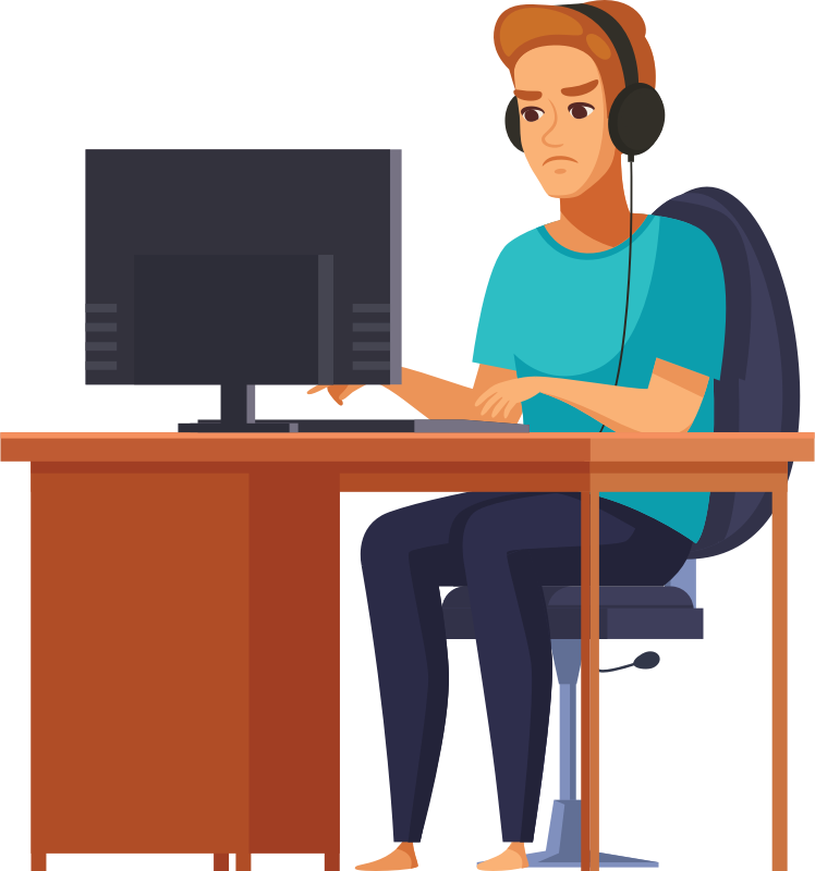 Young Man Sitting At Computer Desk